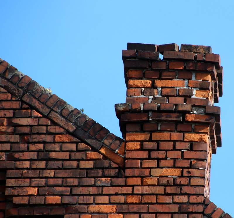 Signs Your Plympton Home Needs a Chimney Inspection Damaged chimney on an Plympton home showing cracks and missing mortar